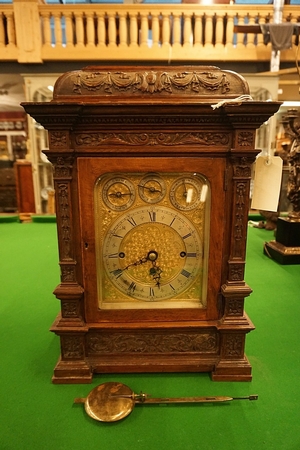 Oak table clock with 8 bells and 5 gongs, around 1900