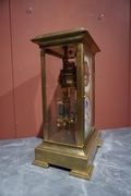 Table clock in Glass and gilded bronze , France 19th C.