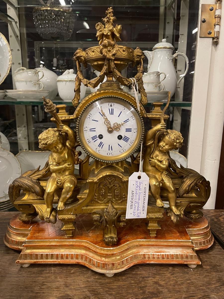 19th century bronze gilded clock. 46w x 46h cm (without wooden console) 