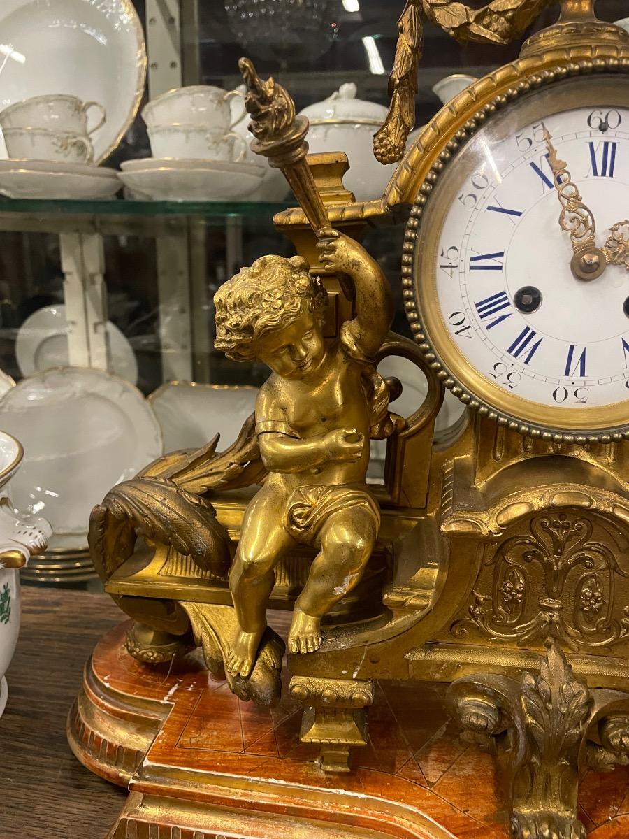 19th century bronze gilded clock. 46w x 46h cm (without wooden console) 