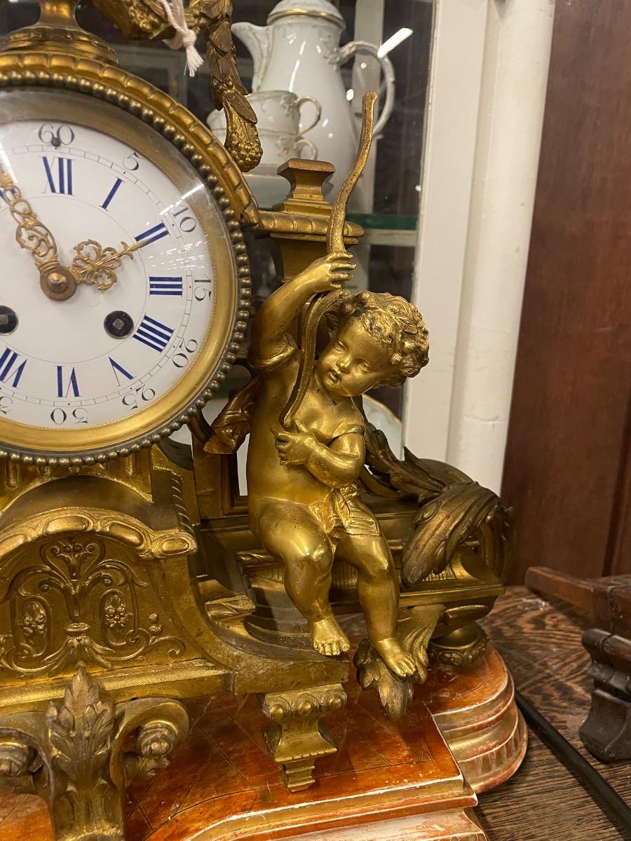 19th century bronze gilded clock. 46w x 46h cm (without wooden console) 