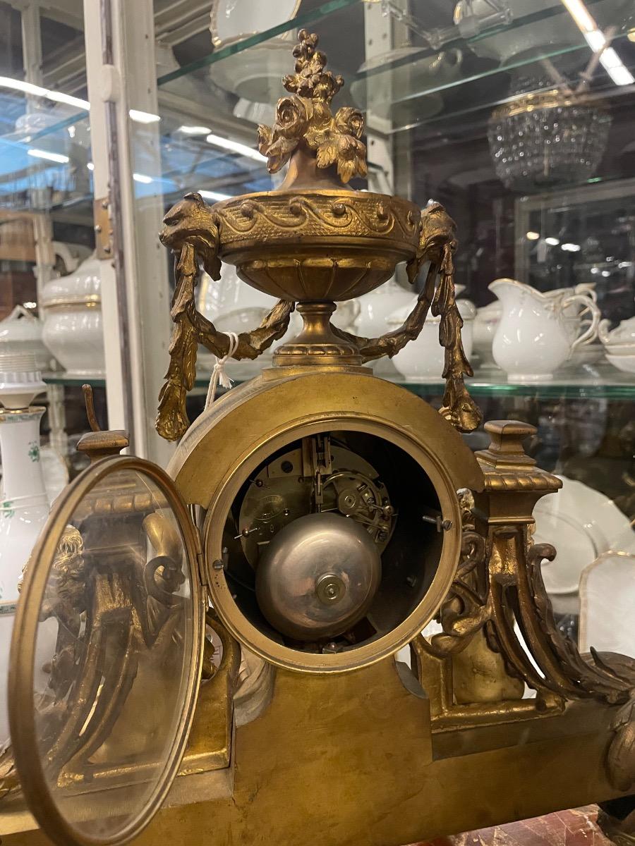 19th century bronze gilded clock. 46w x 46h cm (without wooden console) 