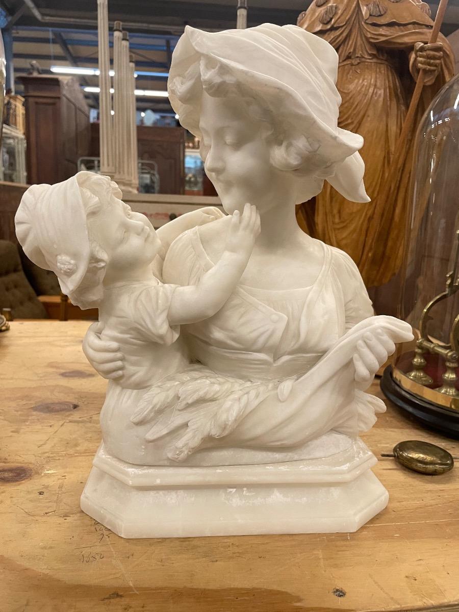 Alabaster sculpture mother with child, signed. 