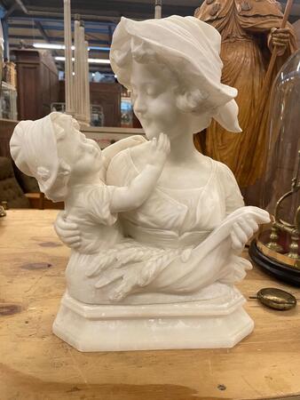Alabaster sculpture mother with child, signed. 