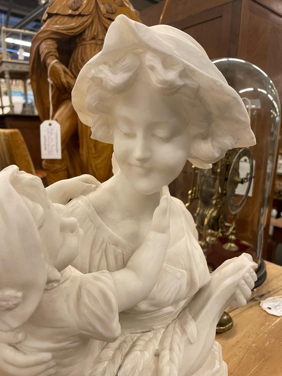 Alabaster sculpture mother with child, signed. 