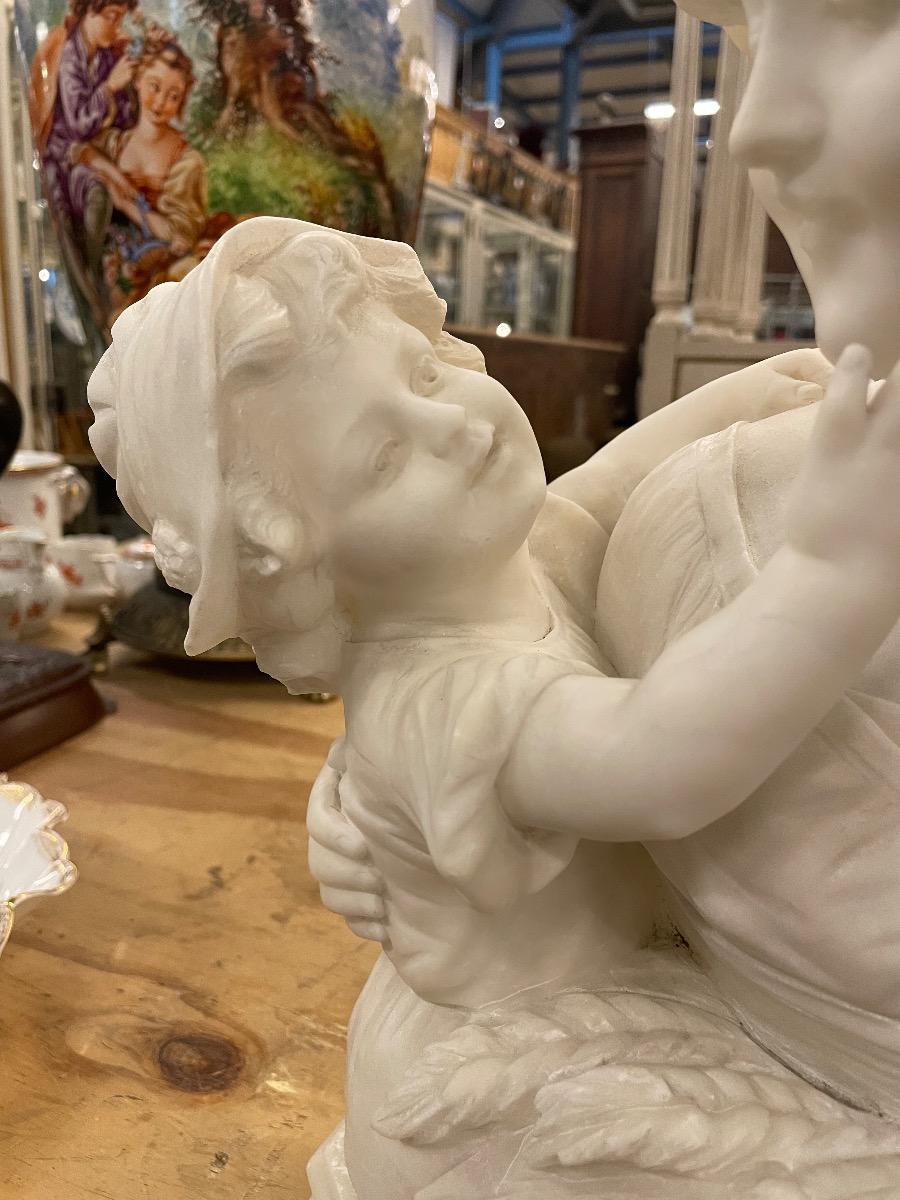 Alabaster sculpture mother with child, signed. 
