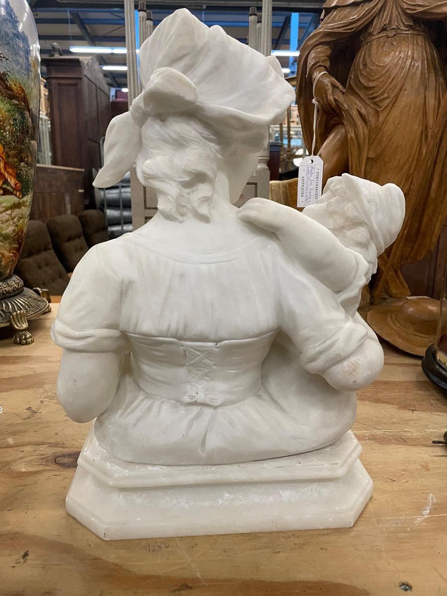 Alabaster sculpture mother with child, signed. 