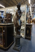 Big bronze nude on marble column Around 1900
