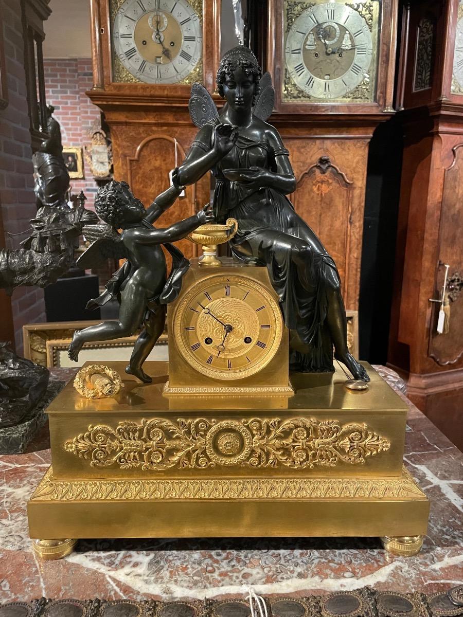 Bronze gilded and patinated Empire clock