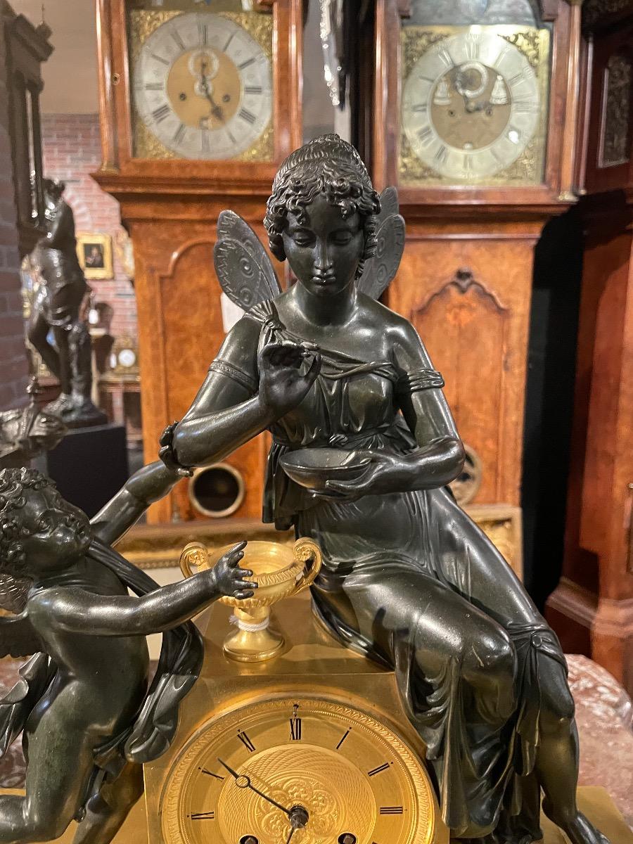Bronze gilded and patinated Empire clock