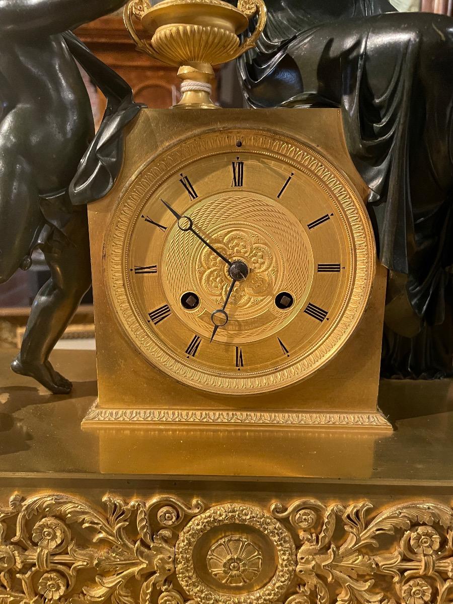 Bronze gilded and patinated Empire clock
