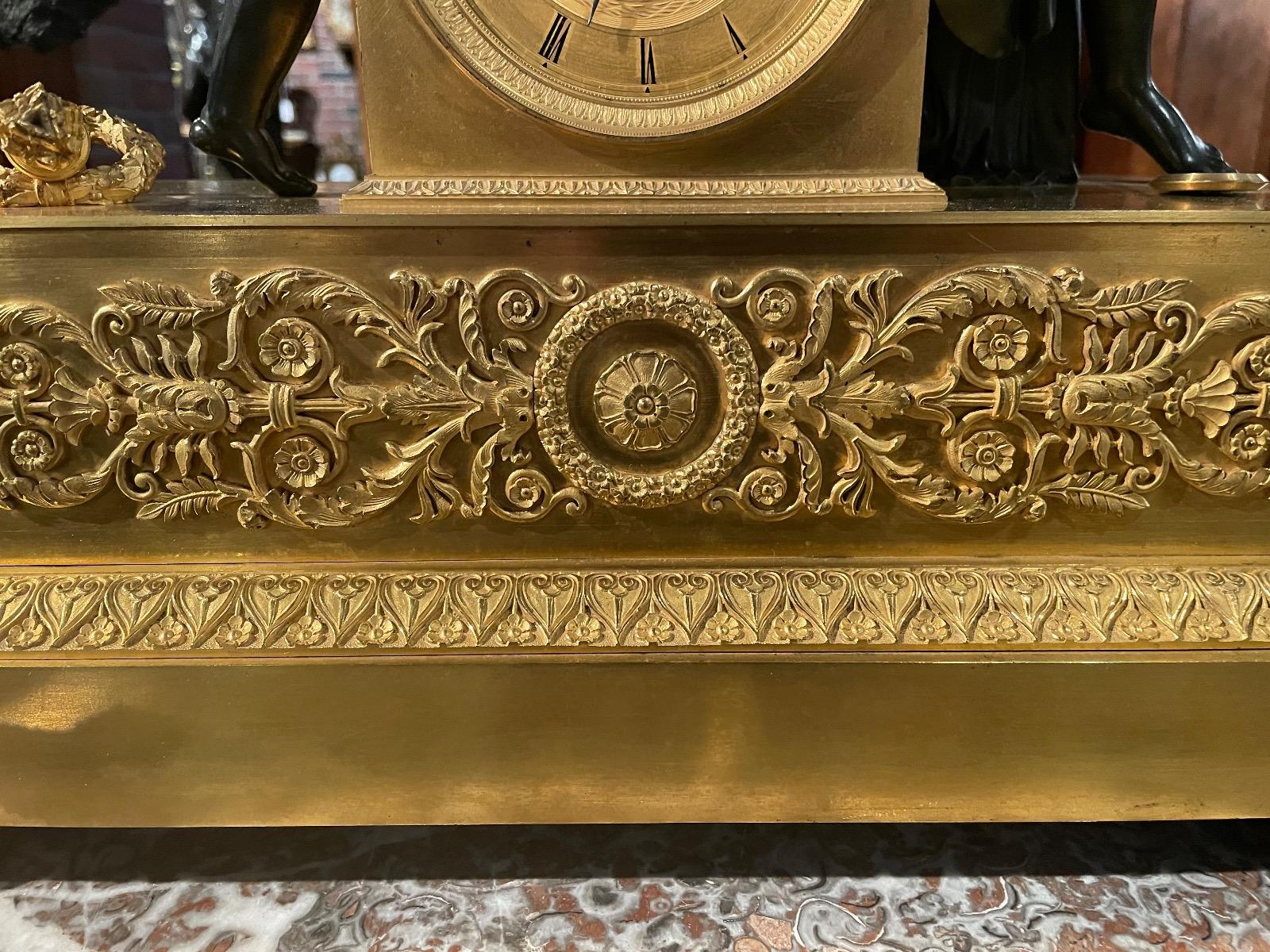 Bronze gilded and patinated Empire clock