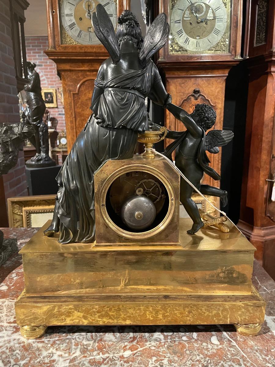 Bronze gilded and patinated Empire clock