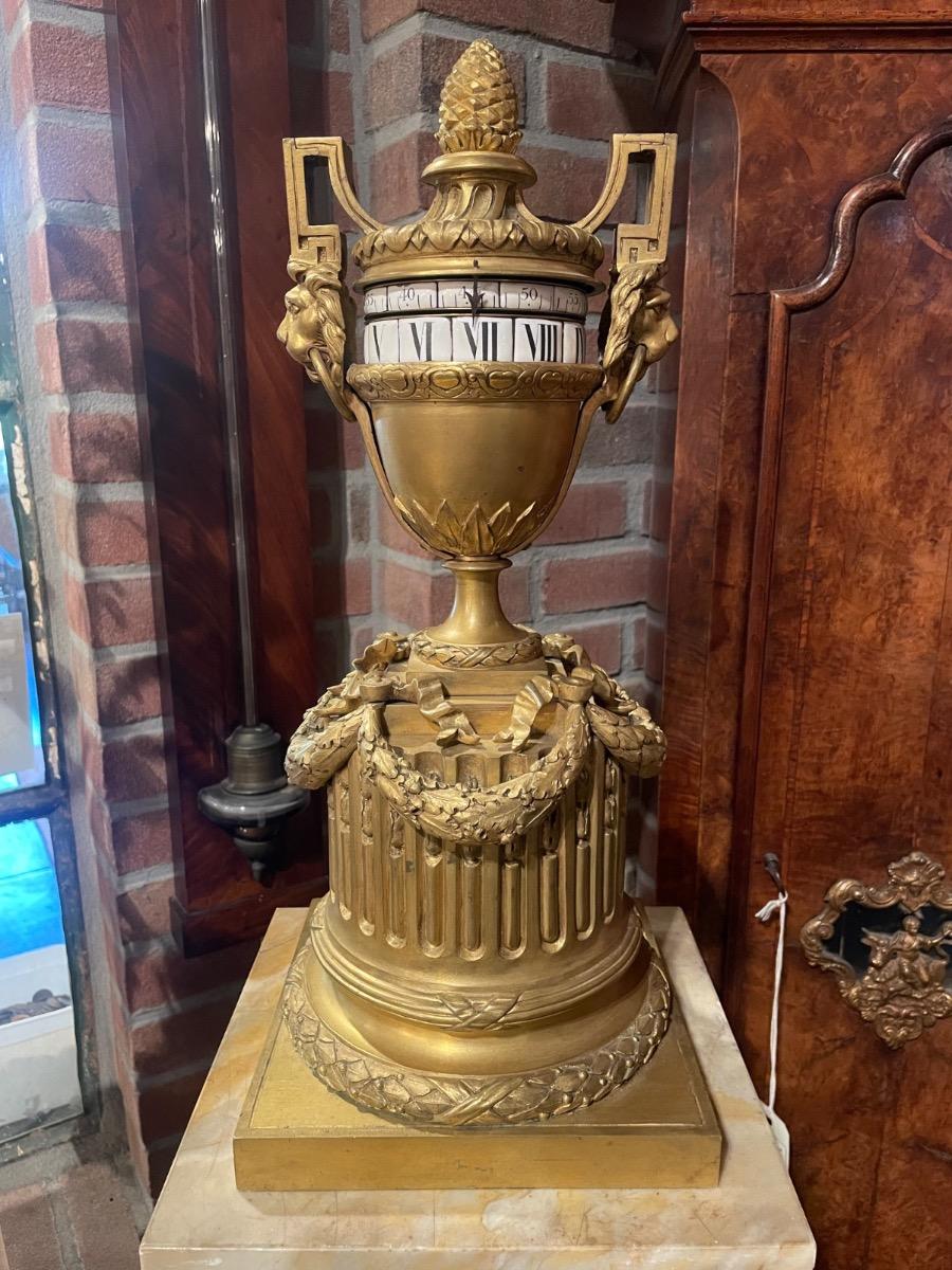 Bronze gilded “circles tournants” tableclock 45 cm tall