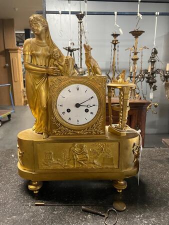 Bronze gilded empire clock. 30x12x39H cm 