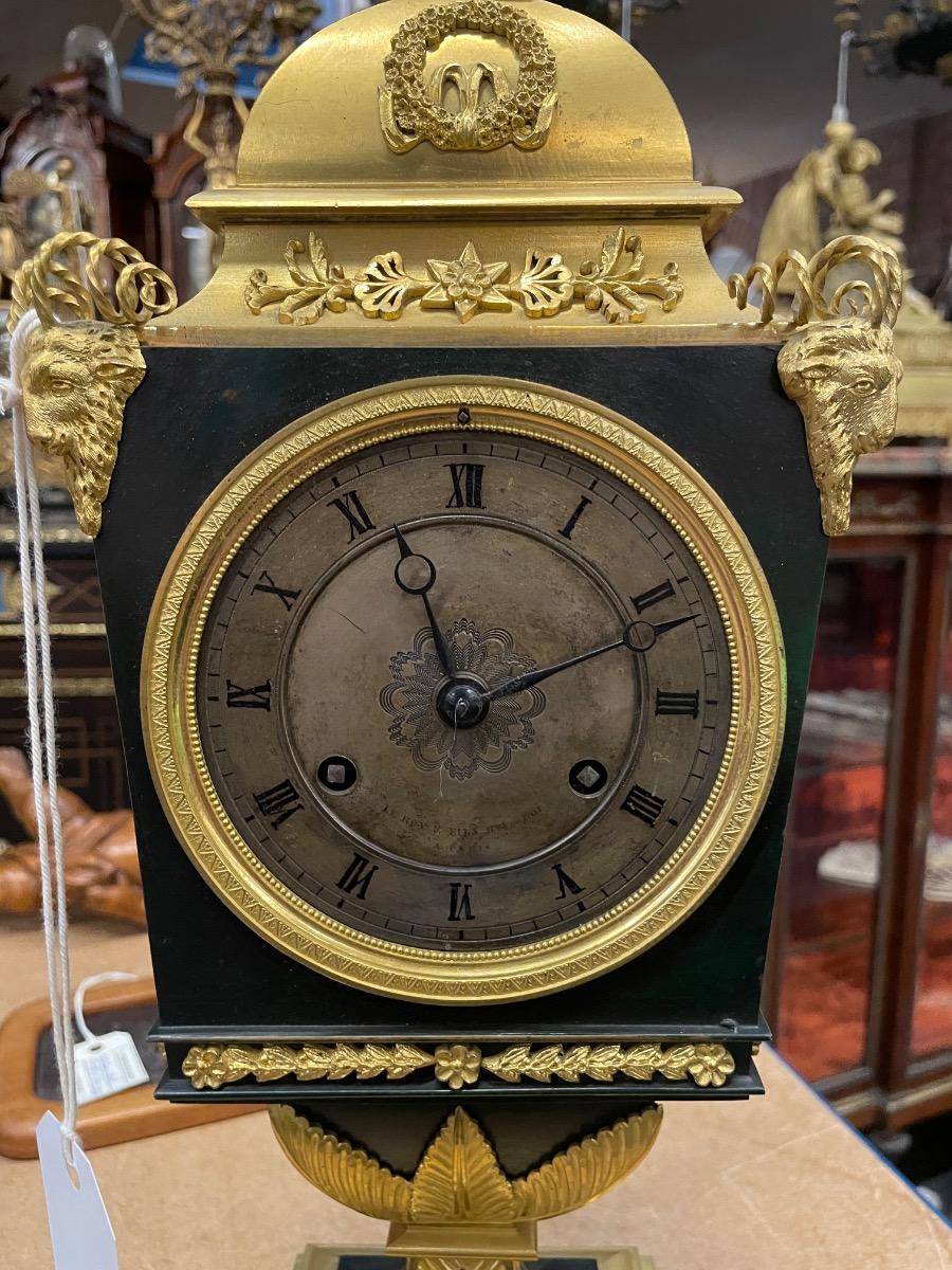 Bronze gilded Empire clock. 46 cm high 