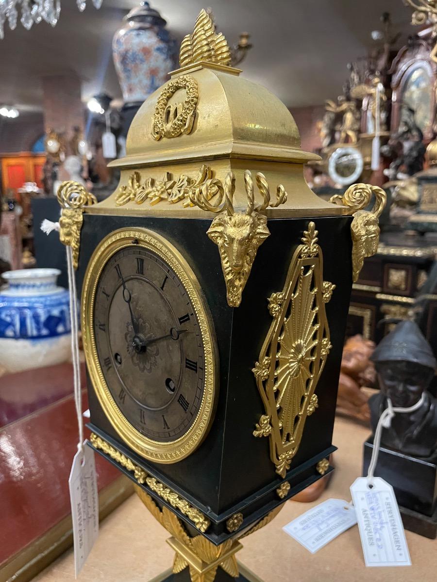 Bronze gilded Empire clock. 46 cm high 