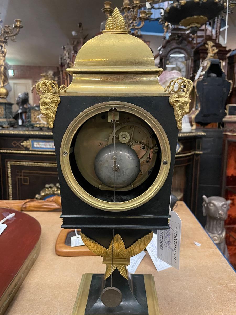 Bronze gilded Empire clock. 46 cm high 