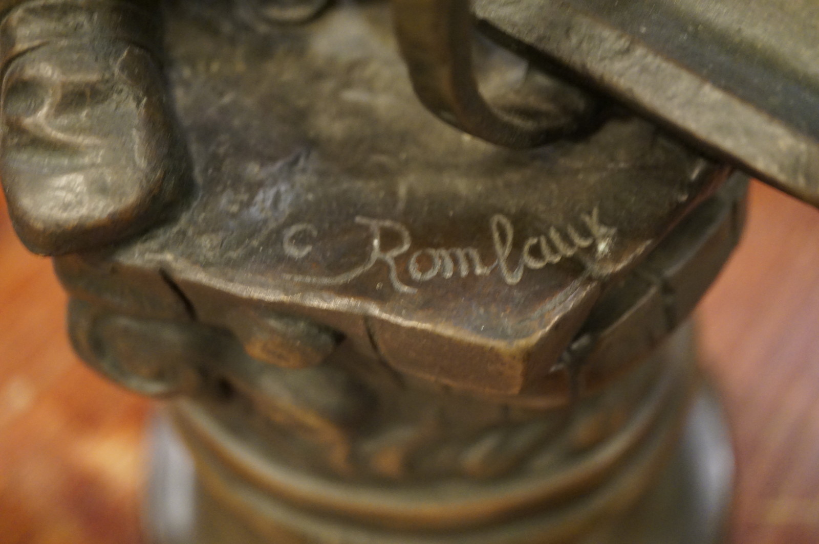 Bronze statue of railway worker, signed