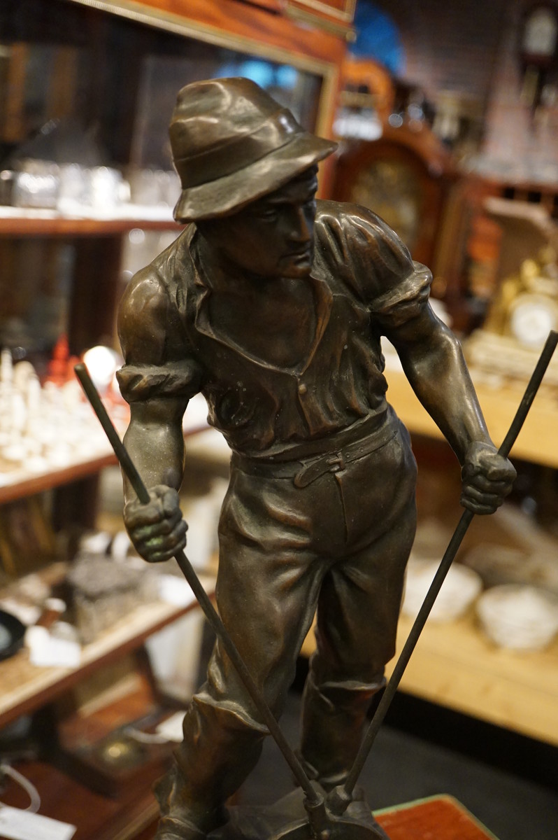 Bronze statue of railway worker, signed