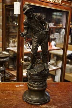 Bronze statue of railway worker, signed