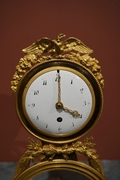 Directoire style Clock in gilded bronze and marble, France last part 18th C.