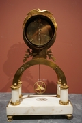 Directoire style Clock in gilded bronze and marble, France last part 18th C.