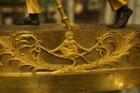Directoire style Porte faix clock in gilded bronze, France around 1800