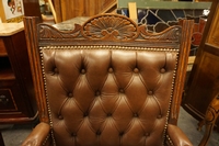 Edwardian pair of armchairs in oak with leather, early 20th C.