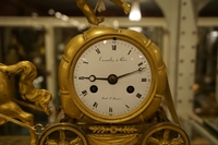 Empire style Chariot clock in gilded bronze, France around 1800