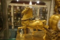 Empire style Chariot clock in gilded bronze, France around 1800