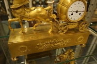 Empire style Chariot clock in gilded bronze, France around 1800