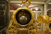 Empire style Chariot clock in gilded bronze, France around 1800