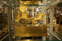 Empire style Chariot clock in gilded bronze, France around 1800