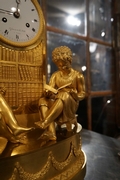 Empire style clock in gilded bronze, France 18th century