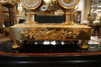 Empire style clock in gilded bronze, France 19th century