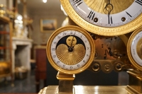 Empire style clock in gilded bronze, France 19th century