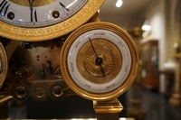 Empire style clock in gilded bronze, France 19th century