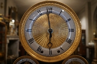 Empire style clock in gilded bronze, France 19th century