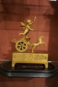 Empire style Miniature Chariot clock in gilded bronze, France around 1800