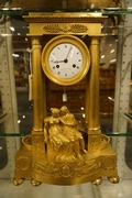 Empire style Portico Clock in gilded bronze, France around 1800