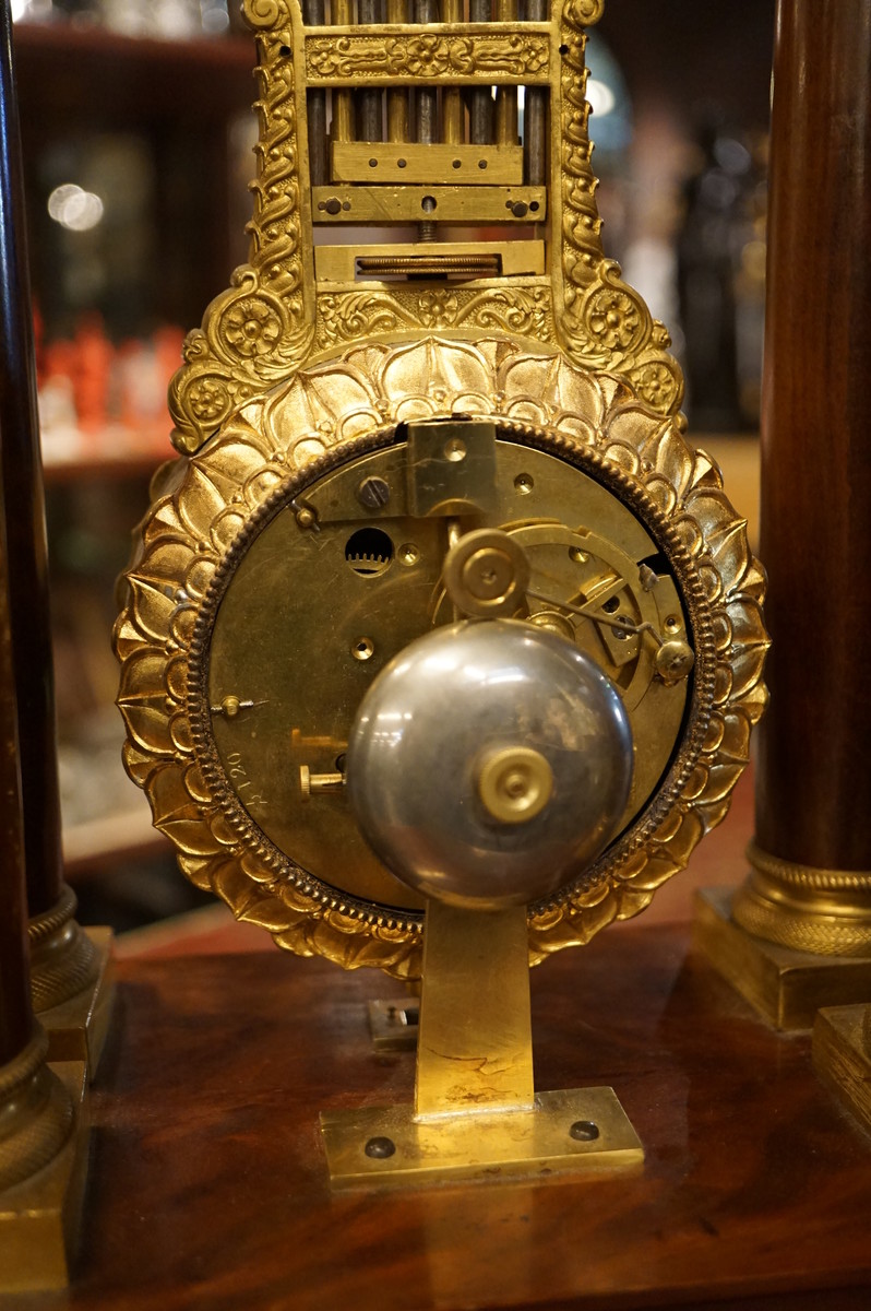 French mahogany mystery portico clock