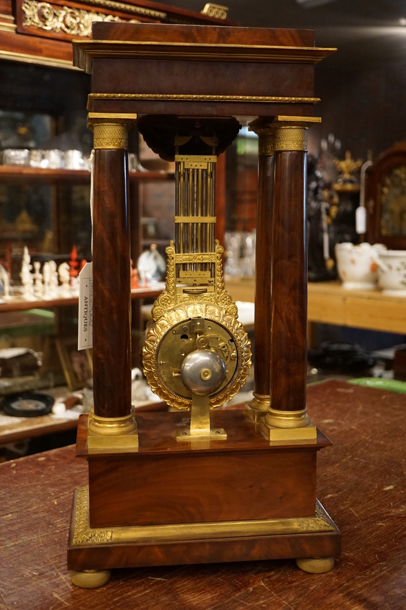 French mahogany mystery portico clock