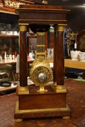 French mahogany mystery portico clock  First half 19th Century