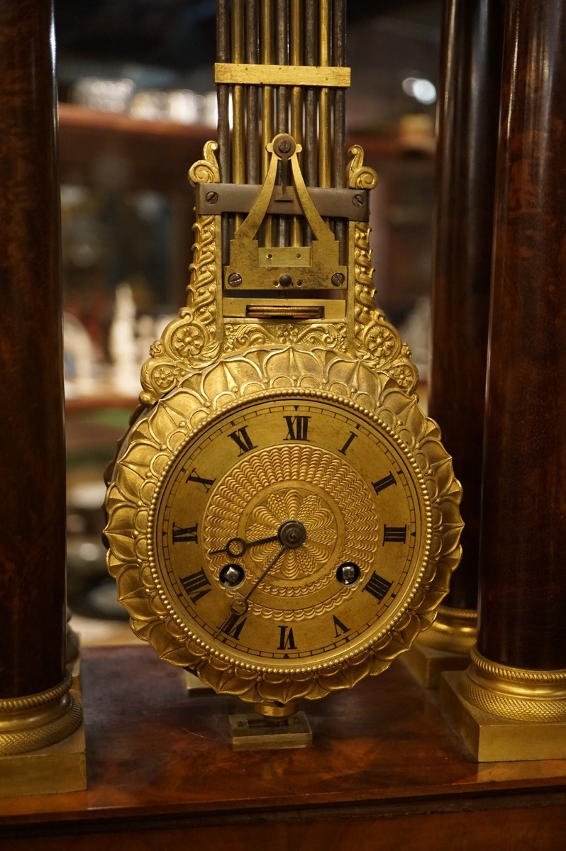 French mahogany mystery portico clock