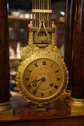 French mahogany mystery portico clock  First half 19th Century