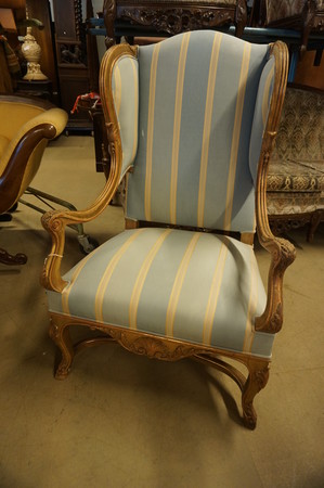 Gilded wingback armchair