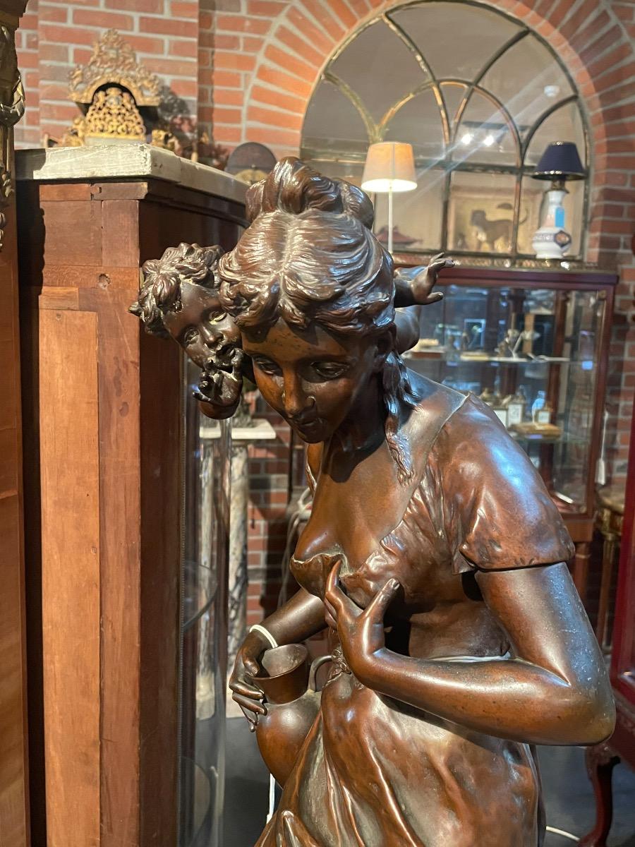 Impressive bronze “secret de l’amour” by carlier on rotating base. 84 cm tall