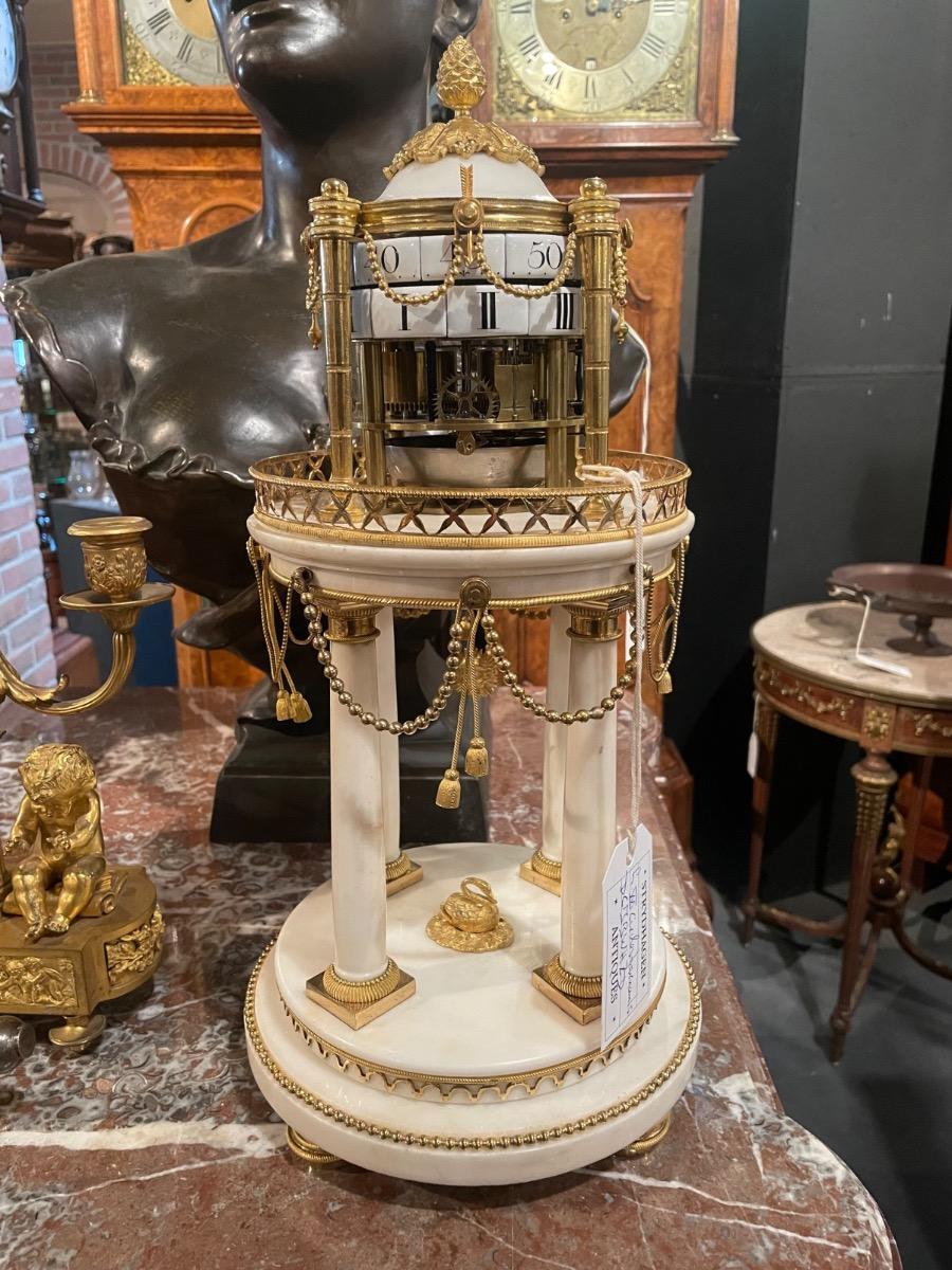 Louis XVI “circles tournants” table clock. 47 cm high