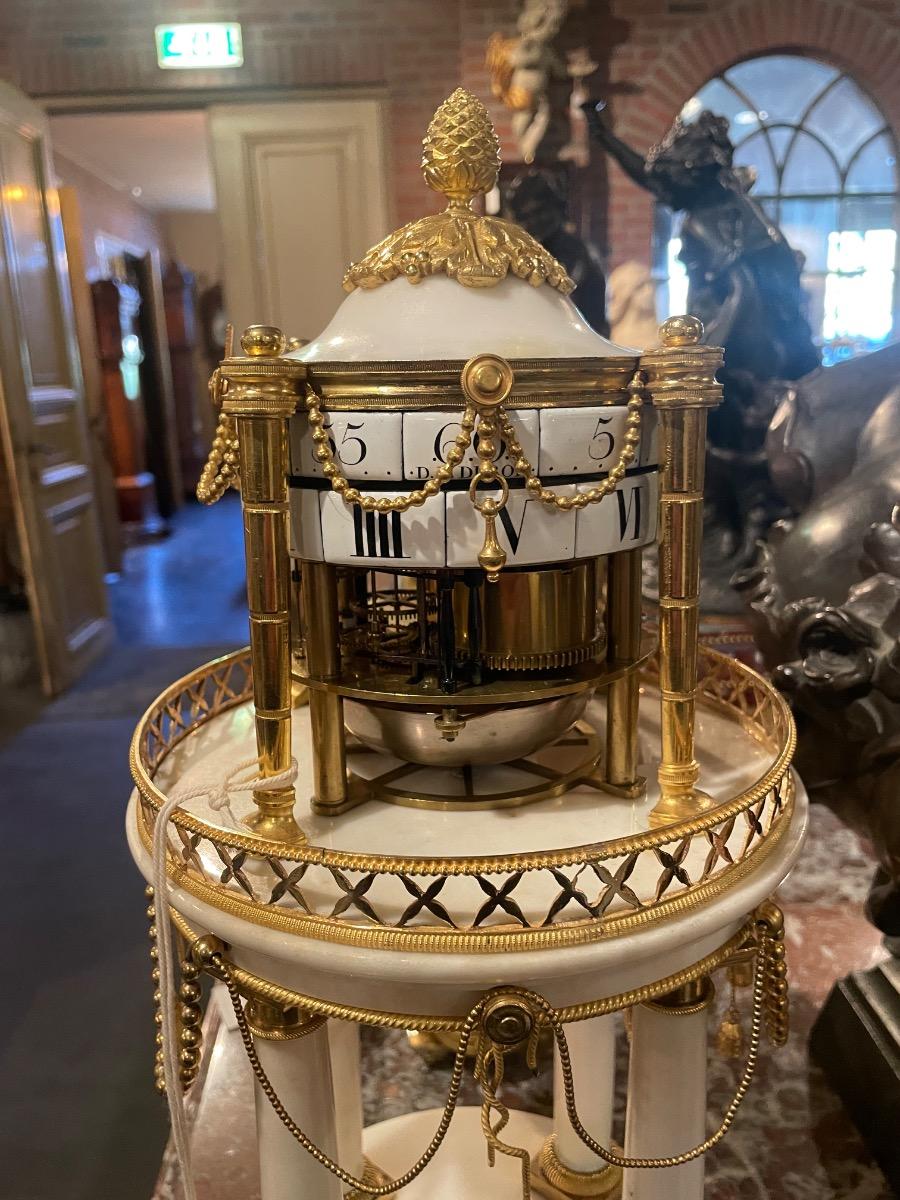 Louis XVI “circles tournants” table clock. 47 cm high